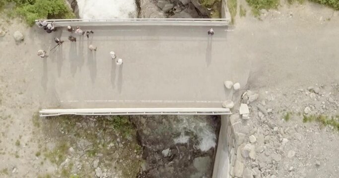 Aerial view of  Rovijokkfossen waterfall on the E8 Nordlysveien road in summer, Storfjord, Troms og Finnmark, Norway.