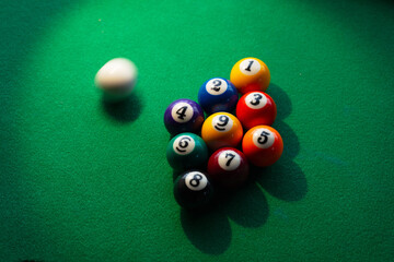 Miss shot. Near miss. Cue ball missing the opening break shot. A nine ball rack and a blurred cue...