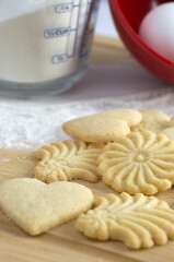Macro Image of Shortbread Biscuit on Wood Table with Measuring Cup and Flour