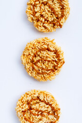 Rice cracker with coconut palm sugar on white