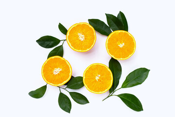Orange fruit with green leaves on white background.