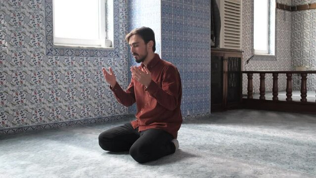 Young Man Praying In Mosque