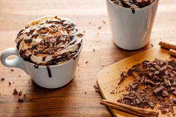 Hot chocolate. Irish coffee or spiked hot chocolate. Classic holiday drink made with hot coffee, Irish cream flavored liquor, mocha, Kahula, chocolate and topped with whipped cream and a cherry.