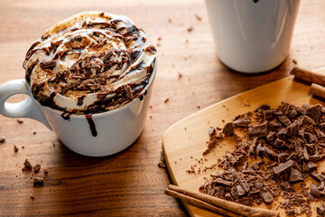 Hot chocolate. Irish coffee or spiked hot chocolate. Classic holiday drink made with hot coffee, Irish cream flavored liquor, mocha, Kahula, chocolate and topped with whipped cream and a cherry.