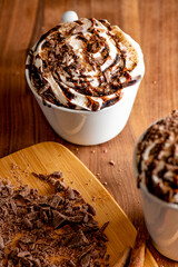 Hot chocolate. Irish coffee or spiked hot chocolate. Classic holiday drink made with hot coffee, Irish cream flavored liquor, mocha, Kahula, chocolate and topped with whipped cream and a cherry.
