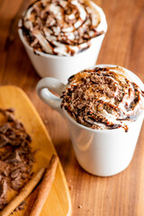 Hot chocolate. Irish coffee or spiked hot chocolate. Classic holiday drink made with hot coffee, Irish cream flavored liquor, mocha, Kahula, chocolate and topped with whipped cream and a cherry.