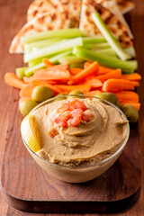 Hummus, Tzatziki served with pita bread and mezze. Greek and Mediterranean dips and spreads. Traditional classic Turkish and Greek cuisines. Hummus, Tzatziki served with pita bread and mezze. 