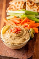 Hummus, Tzatziki served with pita bread and mezze. Greek and Mediterranean dips and spreads. Traditional classic Turkish and Greek cuisines. Hummus, Tzatziki served with pita bread and mezze. 