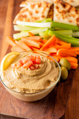 Hummus, Tzatziki served with pita bread and mezze. Greek and Mediterranean dips and spreads. Traditional classic Turkish and Greek cuisines. Hummus, Tzatziki served with pita bread and mezze. 