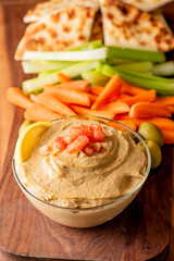 Hummus, Tzatziki served with pita bread and mezze. Greek and Mediterranean dips and spreads. Traditional classic Turkish and Greek cuisines. Hummus, Tzatziki served with pita bread and mezze. 