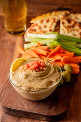 Hummus, Tzatziki served with pita bread and mezze. Greek and Mediterranean dips and spreads. Traditional classic Turkish and Greek cuisines. Hummus, Tzatziki served with pita bread and mezze. 