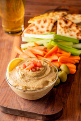 Hummus, Tzatziki served with pita bread and mezze. Greek and Mediterranean dips and spreads. Traditional classic Turkish and Greek cuisines. Hummus, Tzatziki served with pita bread and mezze. 
