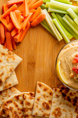 Hummus, Tzatziki served with pita bread and mezze. Greek and Mediterranean dips and spreads. Traditional classic Turkish and Greek cuisines. Hummus, Tzatziki served with pita bread and mezze. 