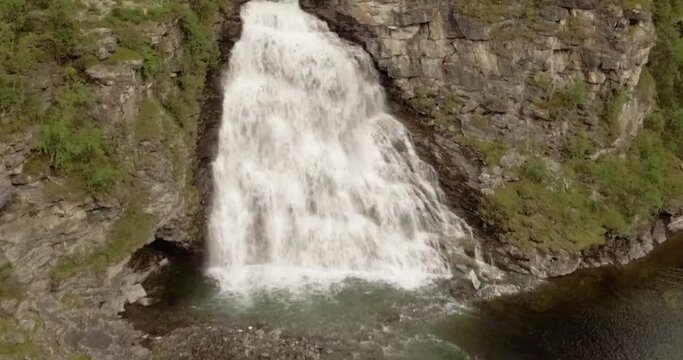 Aerial view of  Rovijokkfossen waterfall on the E8 Nordlysveien road in summer, Storfjord, Troms og Finnmark, Norway.