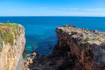 Spectacular cliffs over the rugged Atlantic coast . Blue ocean scenery 