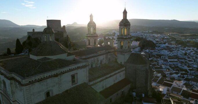 Drone Rotating Over The Cathedral Of Andalusian Town Of Olvera During Sunrise In C&aacute;diz, Andalusia, Spain. Aerial Shot
