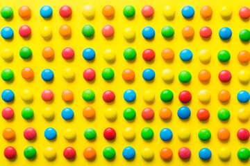 colorful candies as background top view. Seamless pattern with candy. Many sweet candies close-up