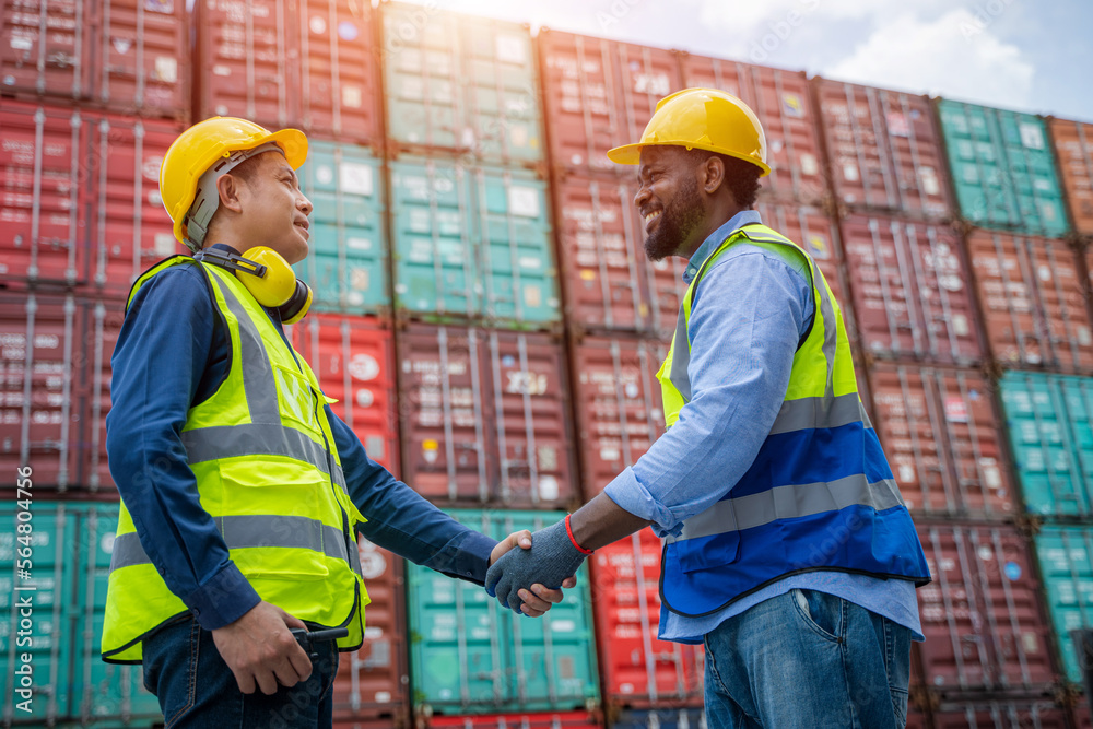 Poster Export and import business,Engineer with foreman  handshake at container terminal,Teamwork and determination to succeed import and export logistics Container