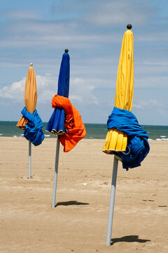 Colorful umbrellas on the beach in Deauville. Normandy, France.