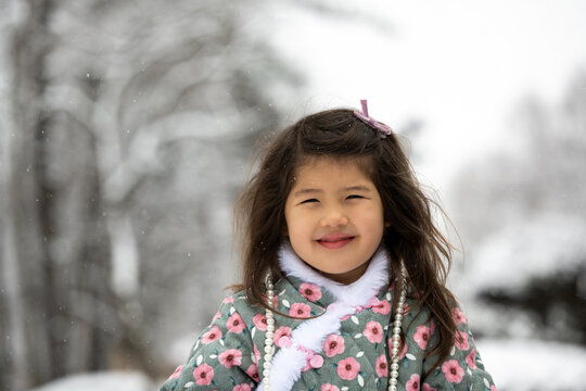 Portrait of happy child in the snow