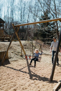Father and Daughter playing in a park