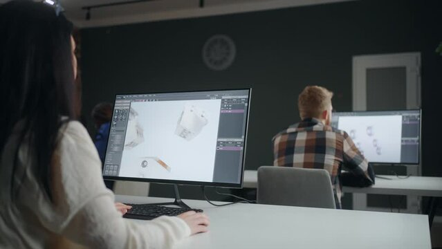 engineers working in coworking room, man and woman creating three-dimensional computer graphics, 3D modelling