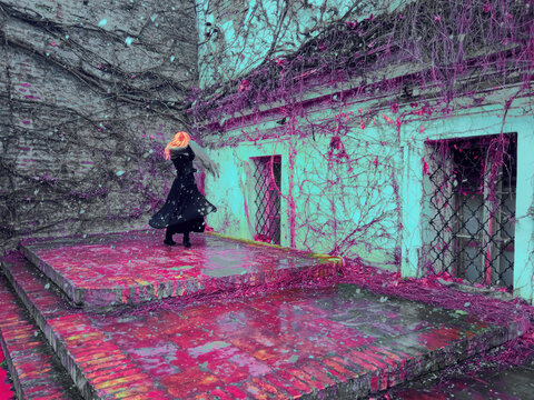 Redhead girl dancing in the snow on the stage solo