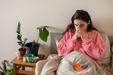 girl blowing her nose in a handkerchief