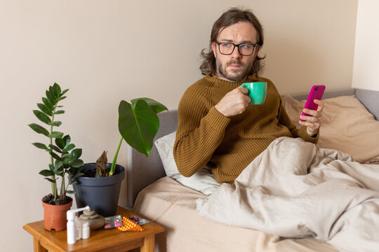 boy sitting sick in bed