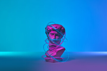 Classical bust wrapped in bright led band.