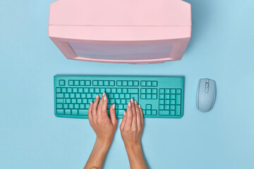 PC monitor with keyboard and woman's hands.