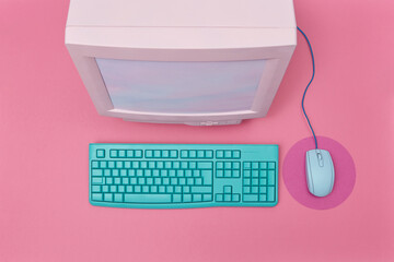 Retro monitor with computer keyboard and mouse.