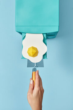 90s computer with paper egg placed in CD drive.