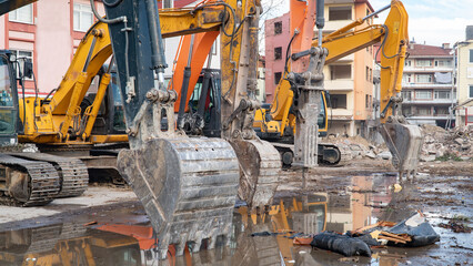 Construction machinery in construction site. Excavator and other heavy machineries.