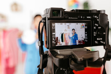 Professional camera recording video of blogger