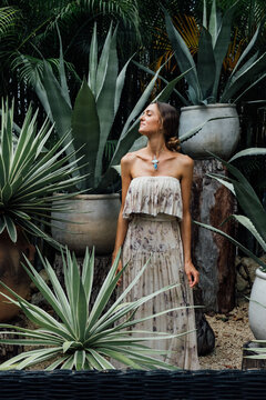 beautiful woman surrounded by agave plants
