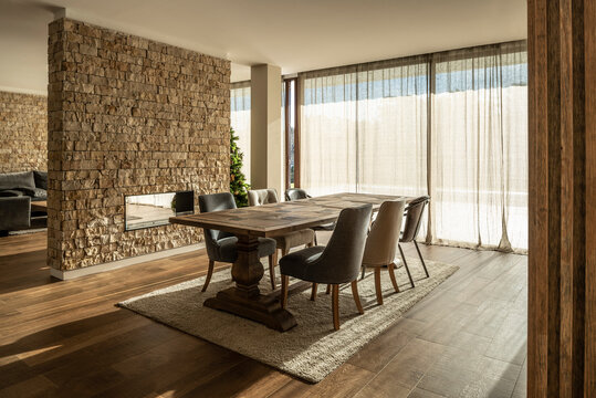 Cozy design dining room. Fire pit, ceramic, wood and stone materials