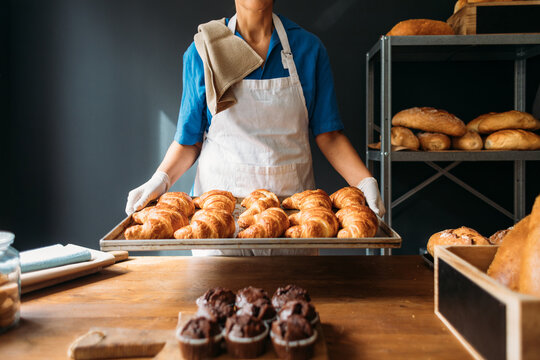 Woman Holding Croissants 