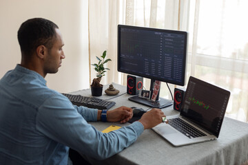 trader working at home by the window