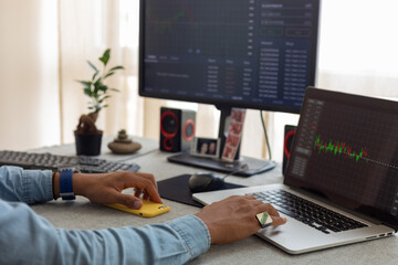 hand man at work on laptop