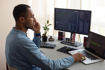 a man monitors the kroptocurrency market
