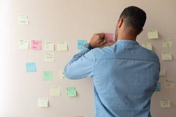 man writing on a sticker