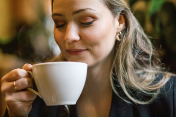 Woman enjoying a cup of coffee