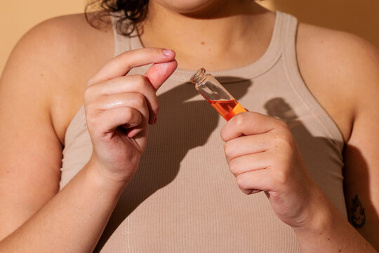 Faceless woman testing cosmetic product