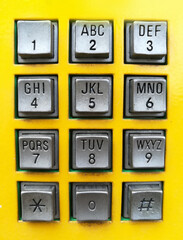 yellow post box telephone