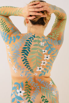 Anonymous plus size model with beautiful floral body art 