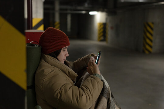 woman reading news on her phone in the dark