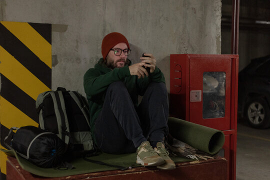 a man sits in a shelter during an alarm