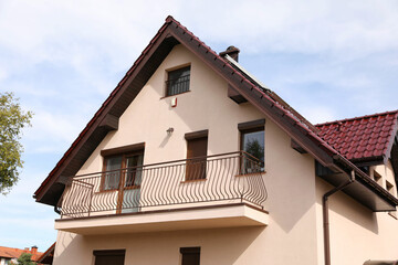 Fototapeta na wymiar Exterior of beautiful modern house against cloudy sky