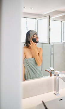 Woman finish morning routine in bathroom.